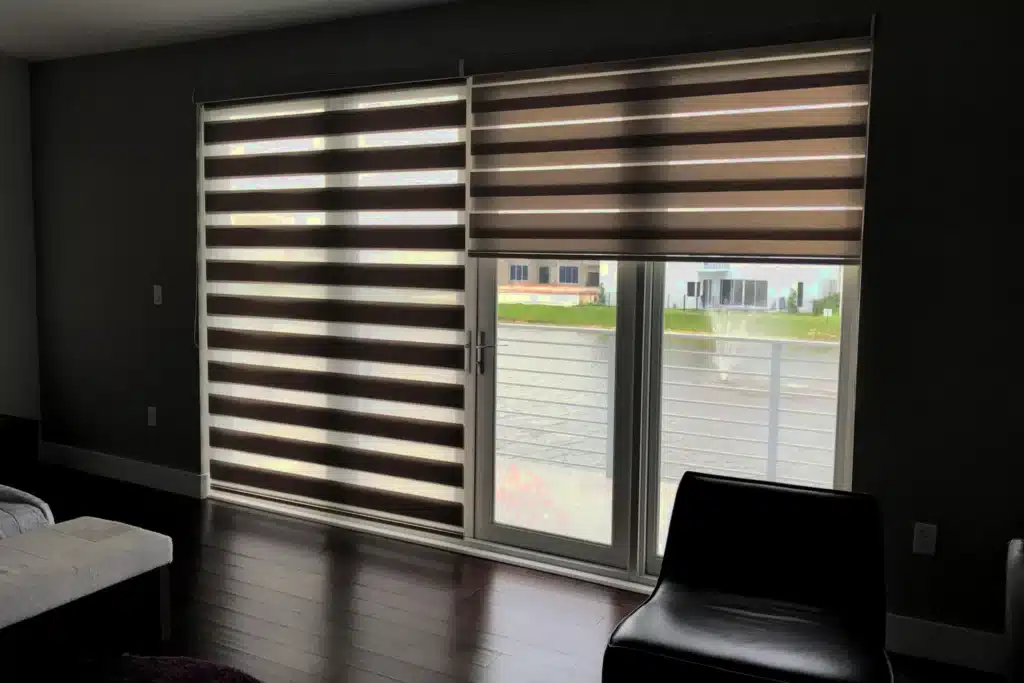 Professional shutter installation in Wanstead featuring elegant zebra blinds on sliding glass doors