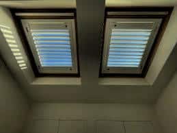 Professional shutter installation in West Ham featuring dual skylight windows with elegant white shutters providing filtered natural lighting