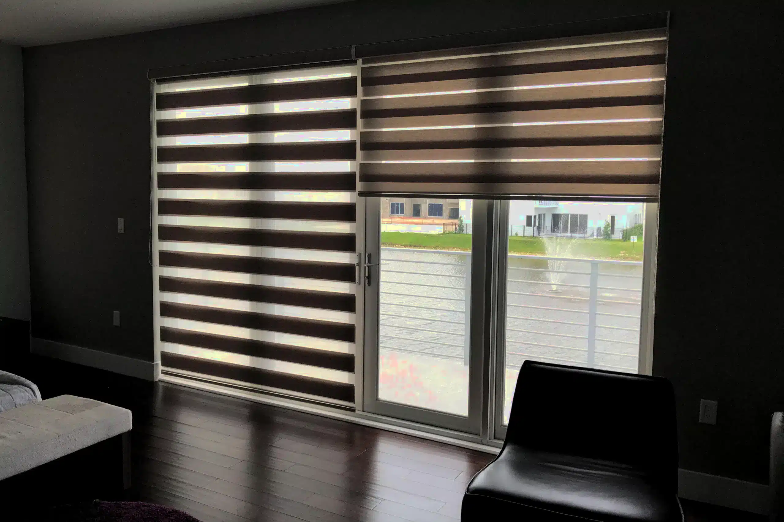 Professional shutter installation in Wanstead featuring elegant zebra blinds on sliding glass doors