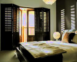 Stylish black plantation shutters installation cost in Benfleet - bedroom window treatment by London Essex Shutters and Blinds