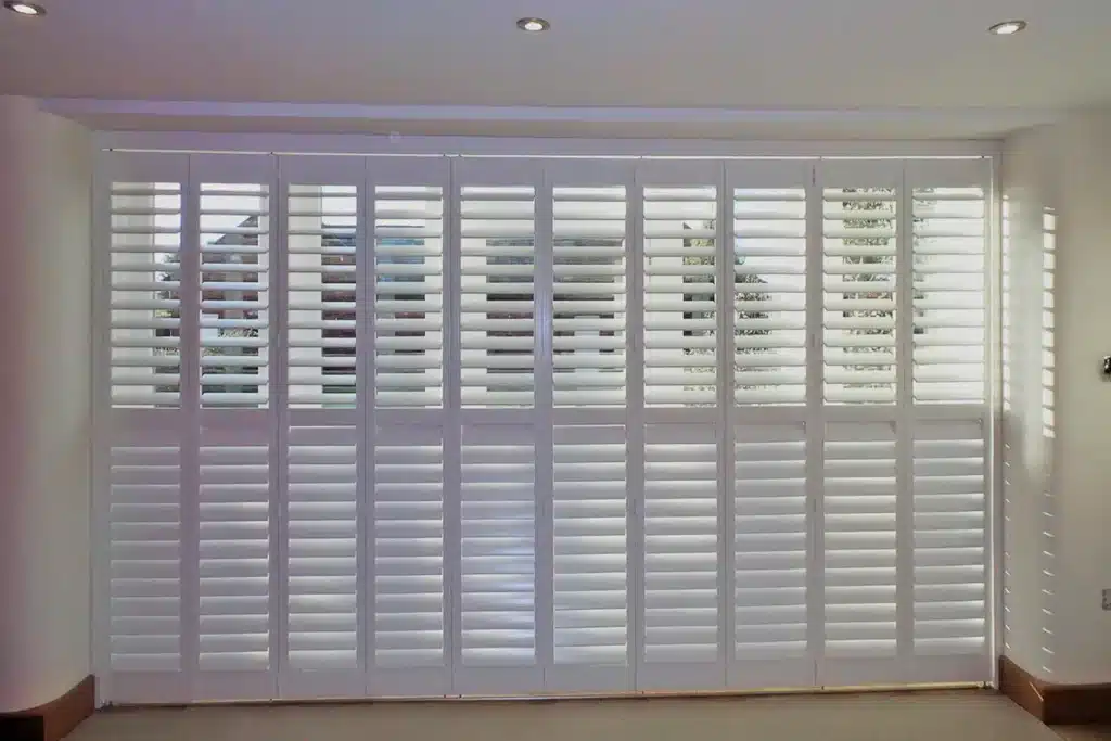 Full height shutters installation in a small London home for optimal light control.