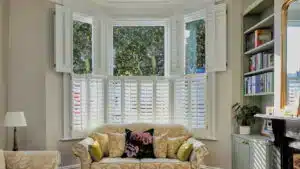 Fitted window shutters in stock showcased in a stylish London living room by London Essex Shutters and Blinds
