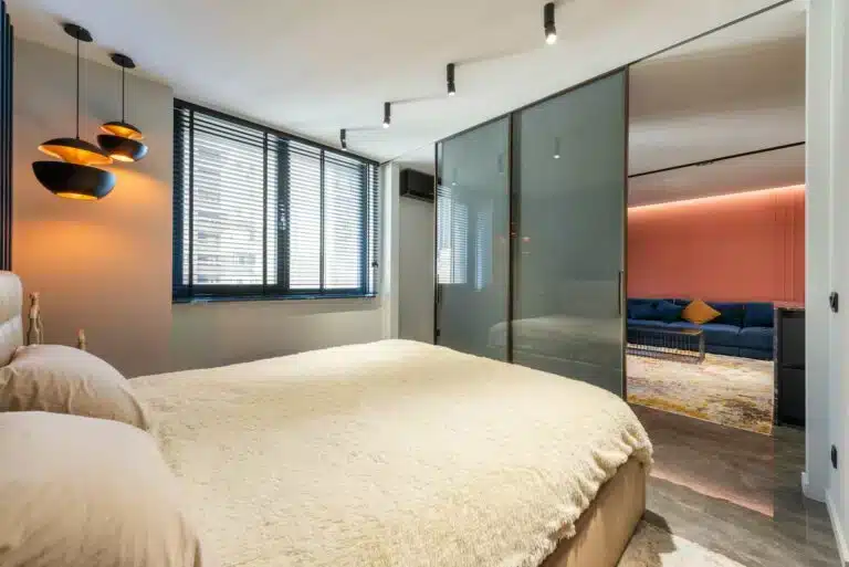 Fitted Window Shutters In Cliffe-at-Hoo modern bedroom interior design with horizontal blinds and contemporary lighting