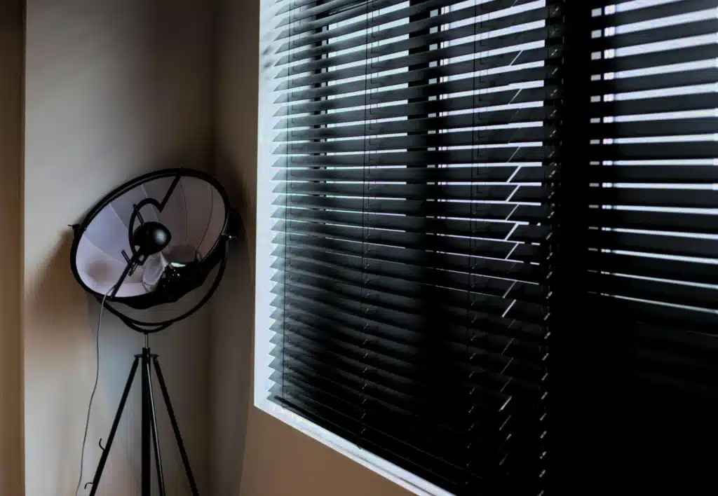 Cozy living area featuring affordable plantation shutters installed in Harlow