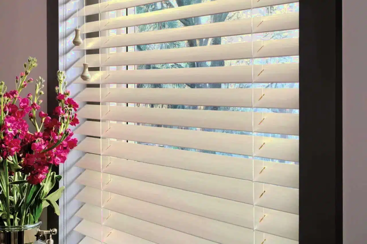 Professional shutter installation in Woolwich featuring bespoke white window coverings